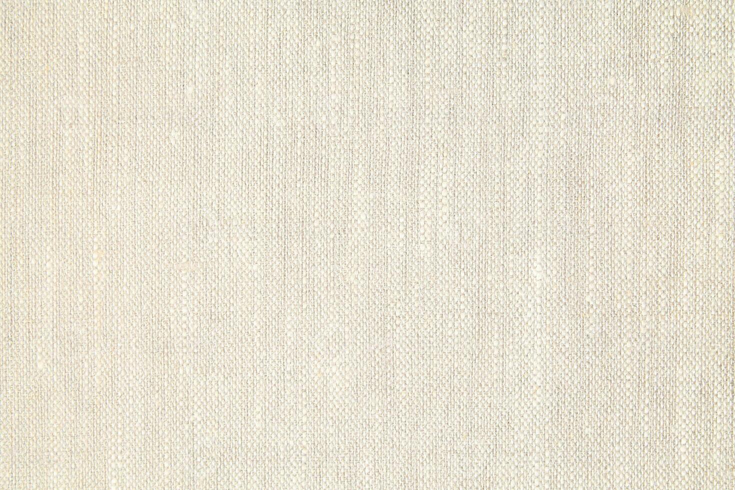 Natural Linen Material Textile Canvas Fabric Texture Background Close-up Detail of Fabric Natural Color Hemp Material Pattern Design Wallpaper. Can be Used as Background or For Graphic Design photo