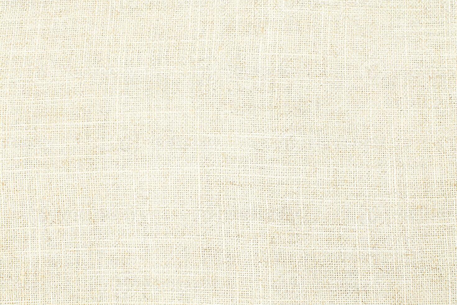 Natural Linen Material Textile Canvas Fabric Texture Background Close-up Detail of Fabric Natural Color Hemp Material Pattern Design Wallpaper. Can be Used as Background or For Graphic Design photo