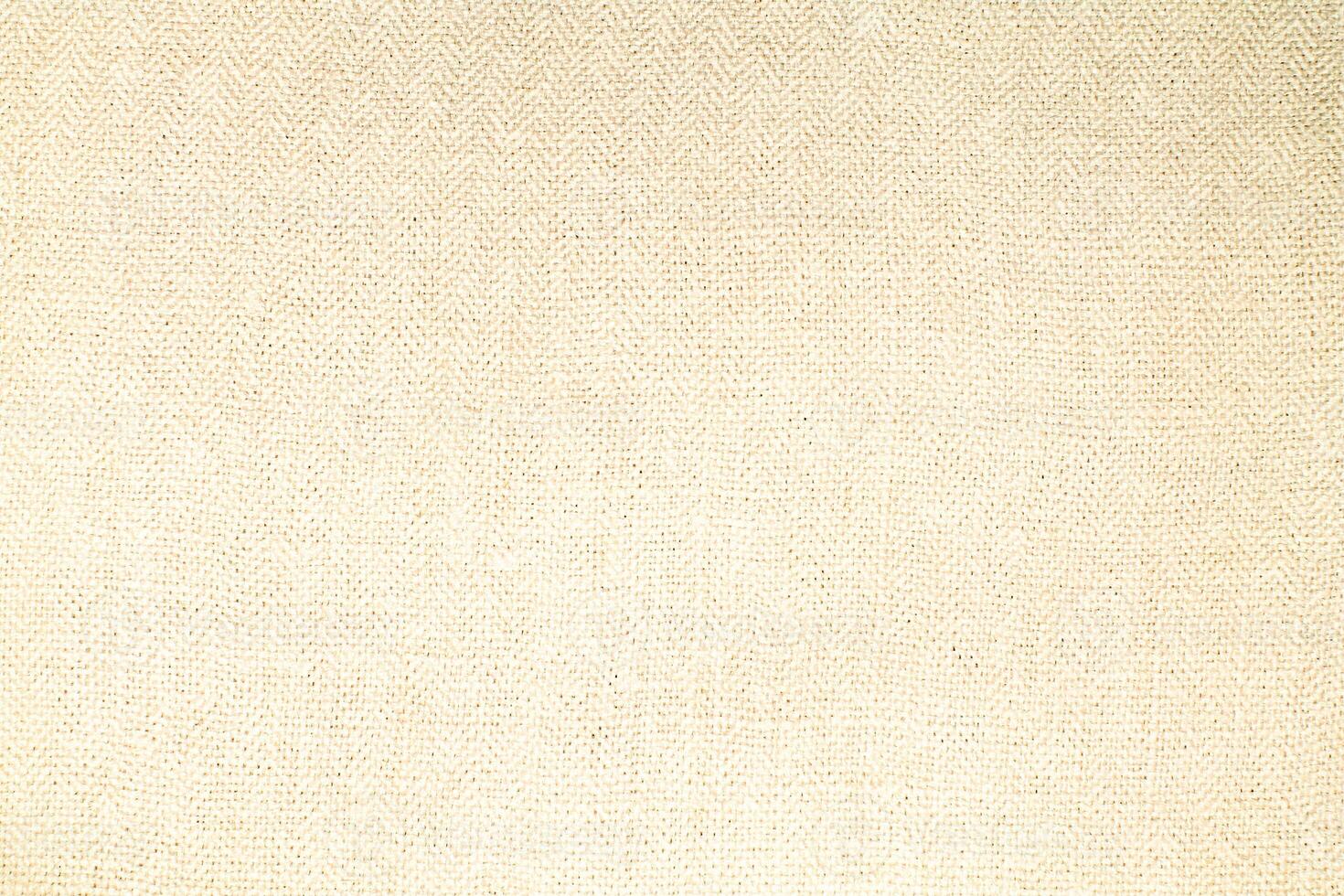 Natural Linen Material Textile Canvas Fabric Texture Background Close-up Detail of Fabric Natural Color Hemp Material Pattern Design Wallpaper. Can be Used as Background or For Graphic Design photo