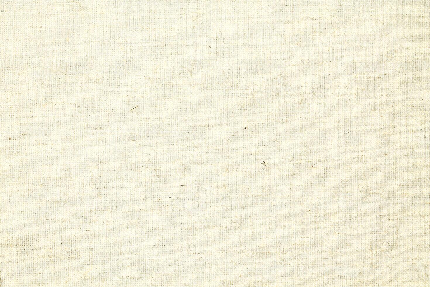 Natural Linen Material Textile Canvas Fabric Texture Background Close-up Detail of Fabric Natural Color Hemp Material Pattern Design Wallpaper. Can be Used as Background or For Graphic Design photo