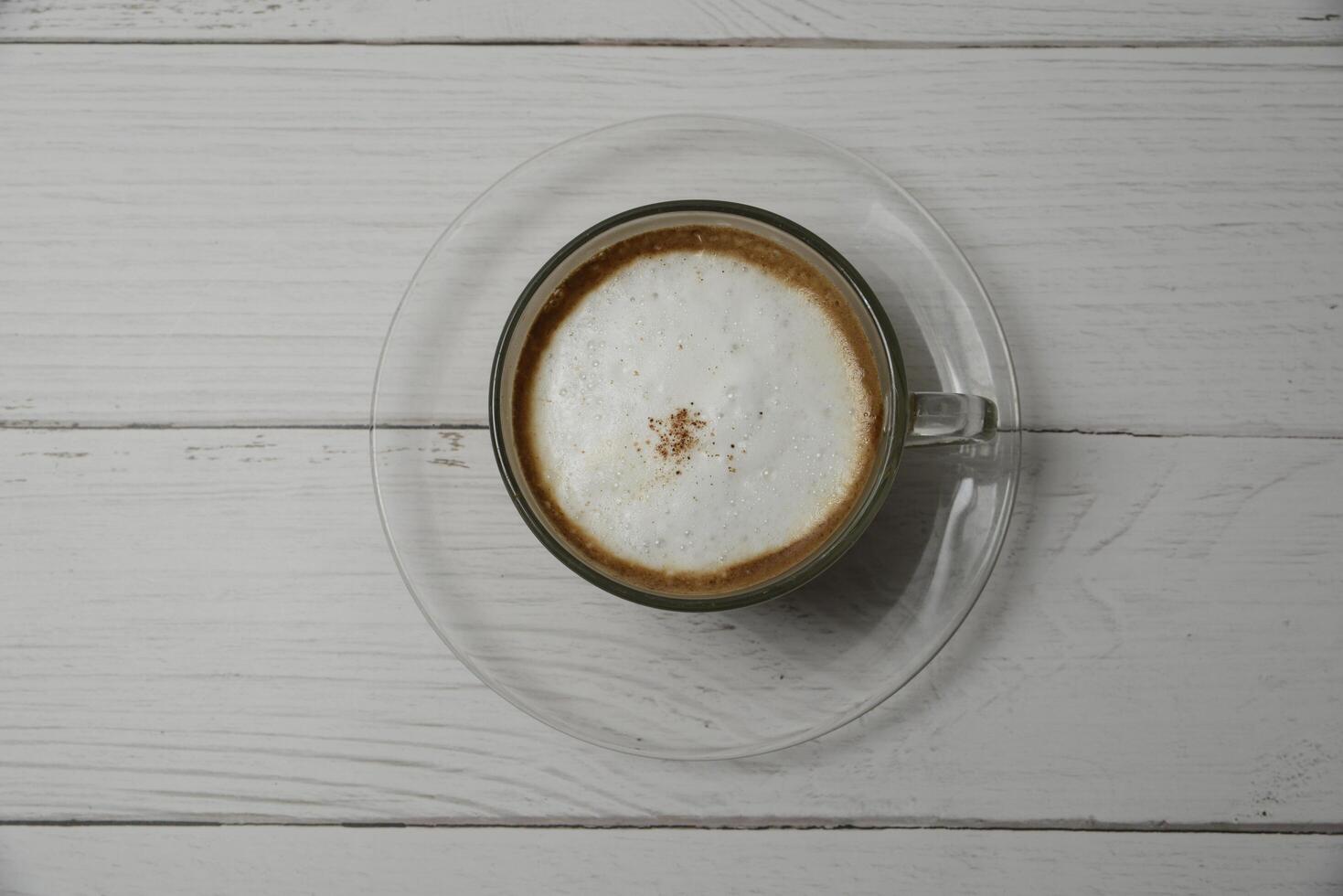 Hot cappuccino, add clmeme. photo