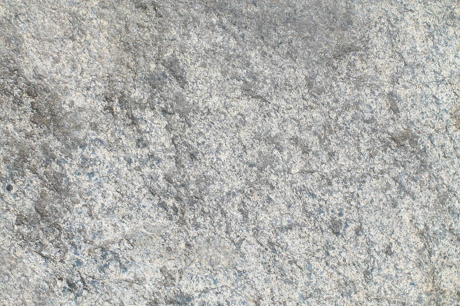 Abstract natural rock stone granite grunge rusty metal texture design background natural color stone material granite design wallpaper. Close-up detail of natural stone photo