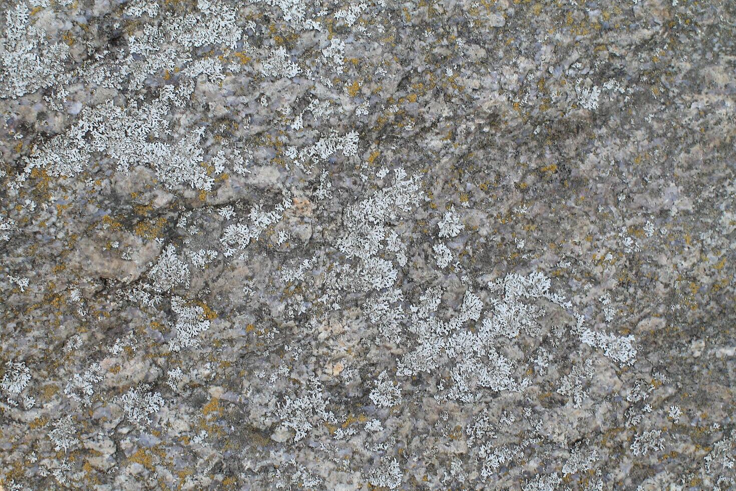 Abstract natural rock stone granite grunge rusty metal texture design background natural color stone material granite design wallpaper. Close-up detail of natural stone photo