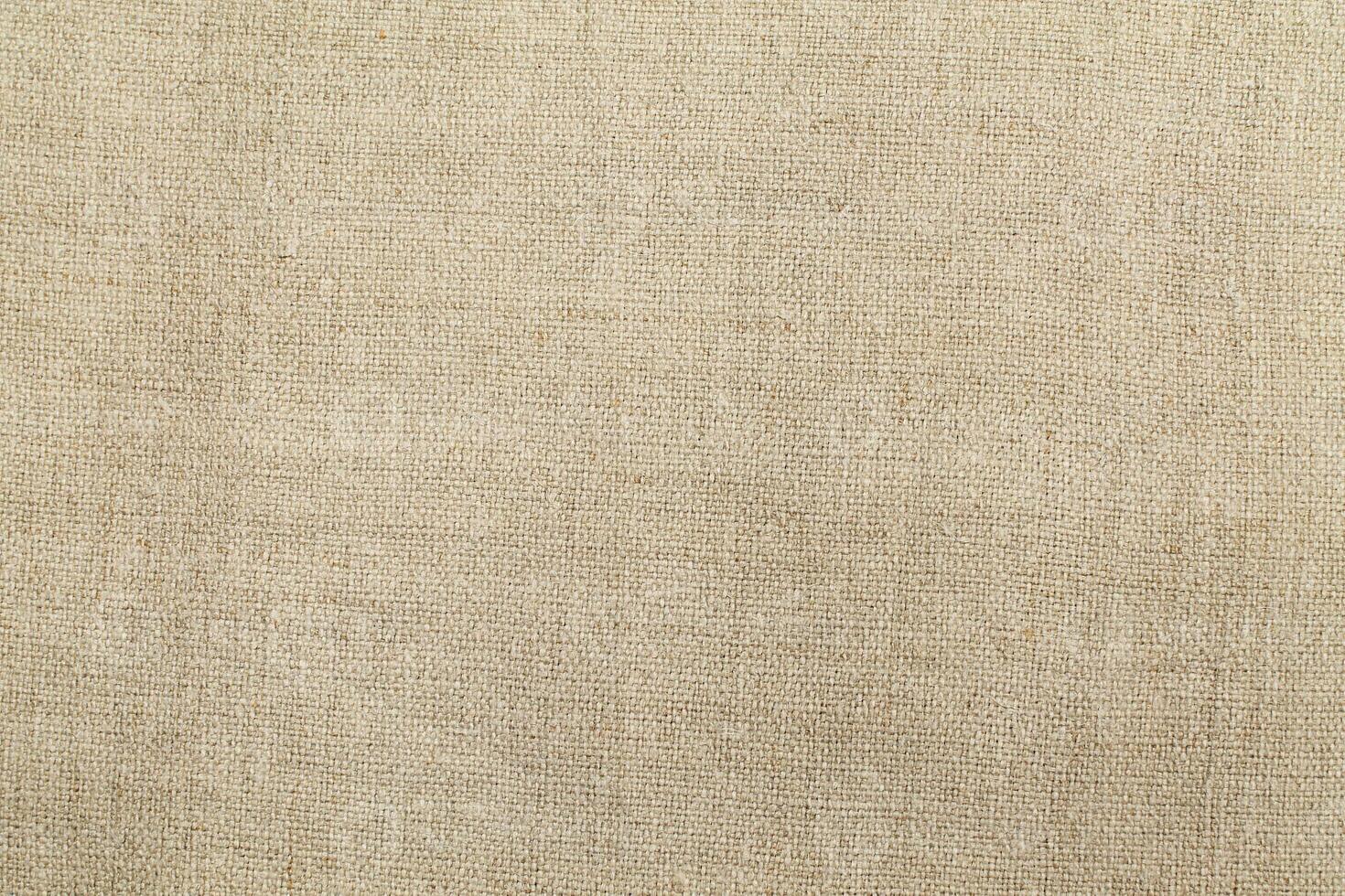 Natural linen material textile canvas Fabric texture background Close-up detail of fabric natural color Hemp material pattern design wallpaper. can be used as background or for graphic design photo