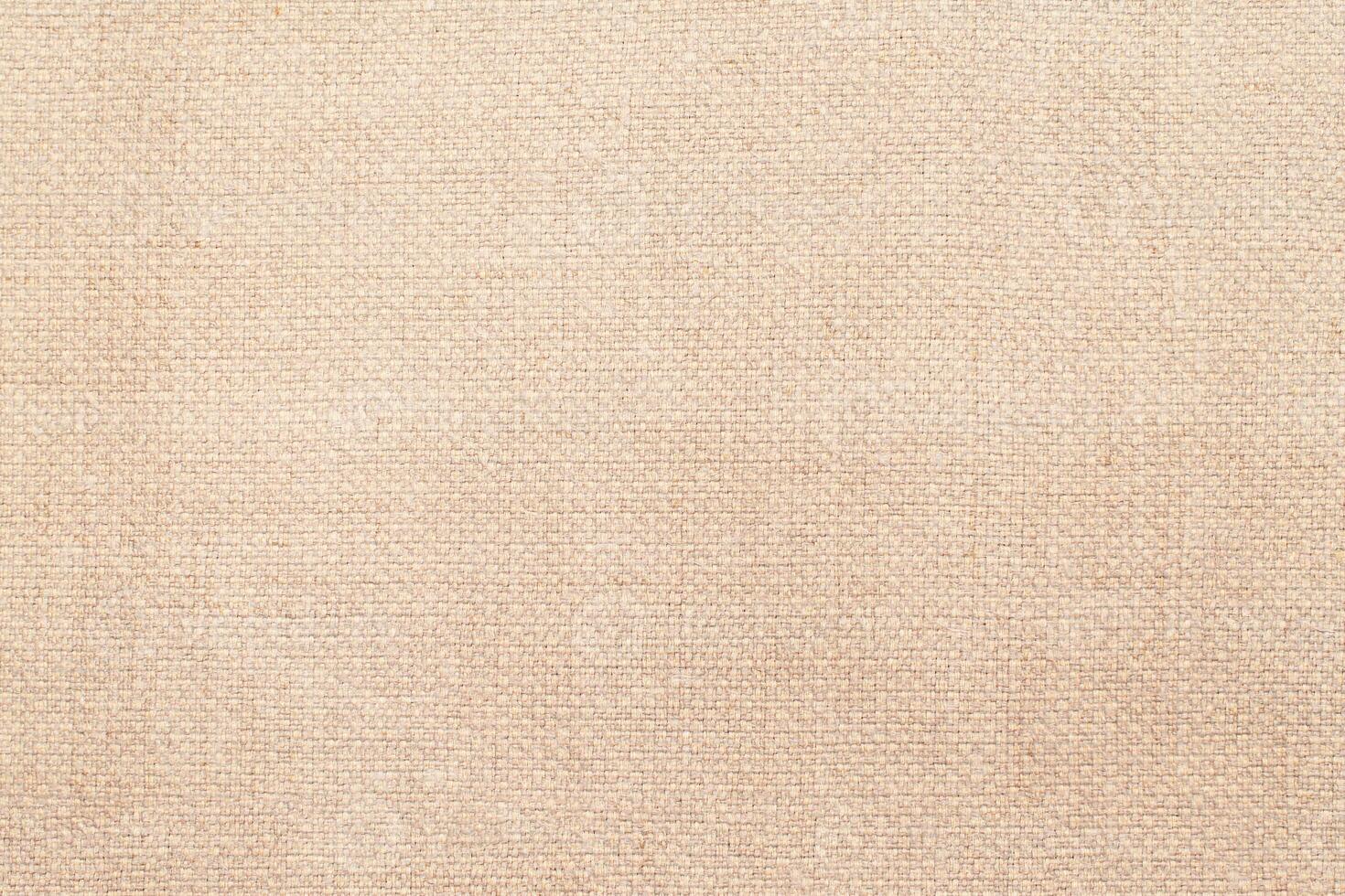 Natural linen material textile canvas Fabric texture background Close-up detail of fabric natural color Hemp material pattern design wallpaper. can be used as background or for graphic design photo