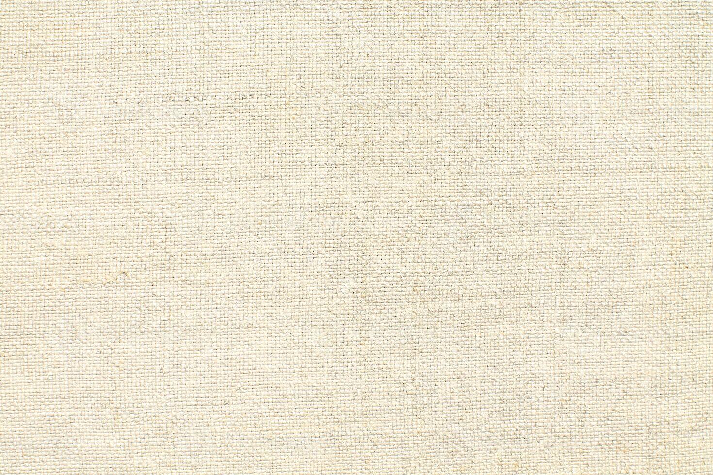 Natural linen material textile canvas Fabric texture background Close-up detail of fabric natural color Hemp material pattern design wallpaper. can be used as background or for graphic design photo