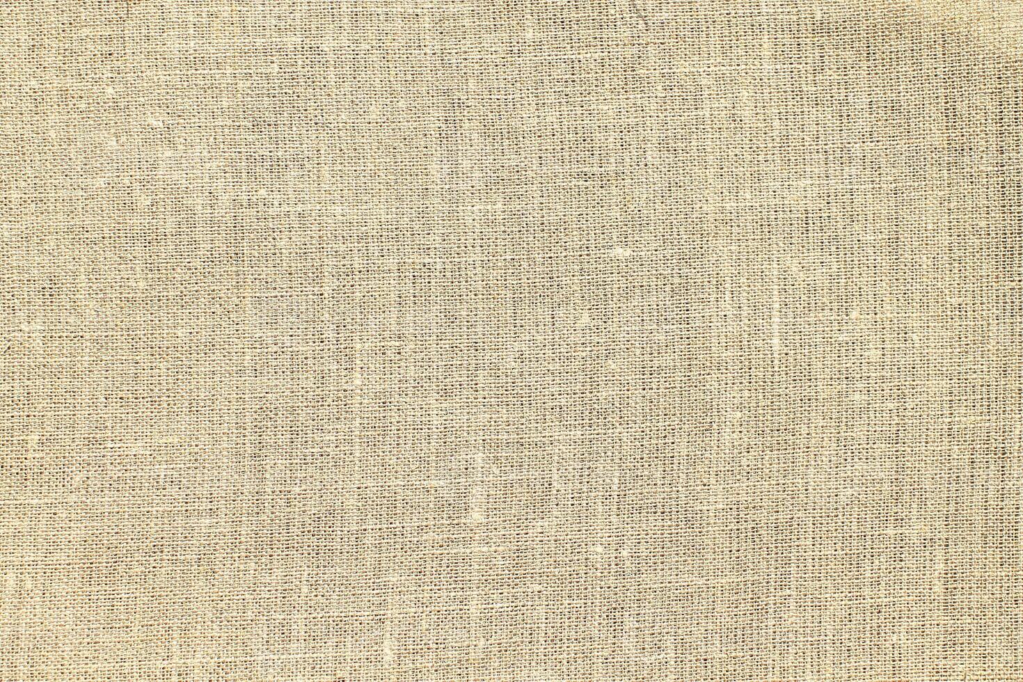 Natural linen material textile canvas Fabric texture background Close-up detail of fabric natural color Hemp material pattern design wallpaper. can be used as background or for graphic design photo