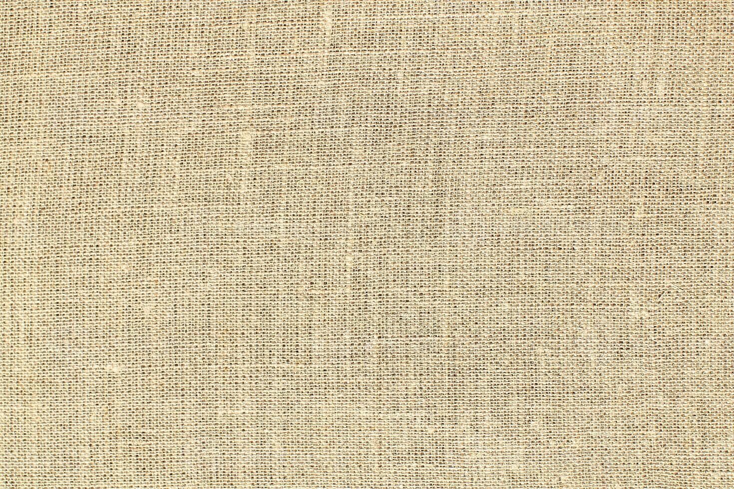 Natural linen material textile canvas Fabric texture background Close-up detail of fabric natural color Hemp material pattern design wallpaper. can be used as background or for graphic design photo
