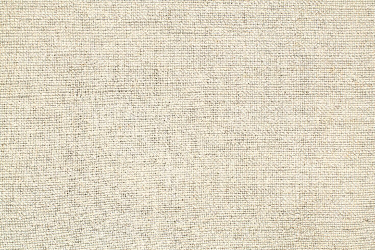 Natural linen material textile canvas Fabric texture background Close-up detail of fabric natural color Hemp material pattern design wallpaper. can be used as background or for graphic design photo