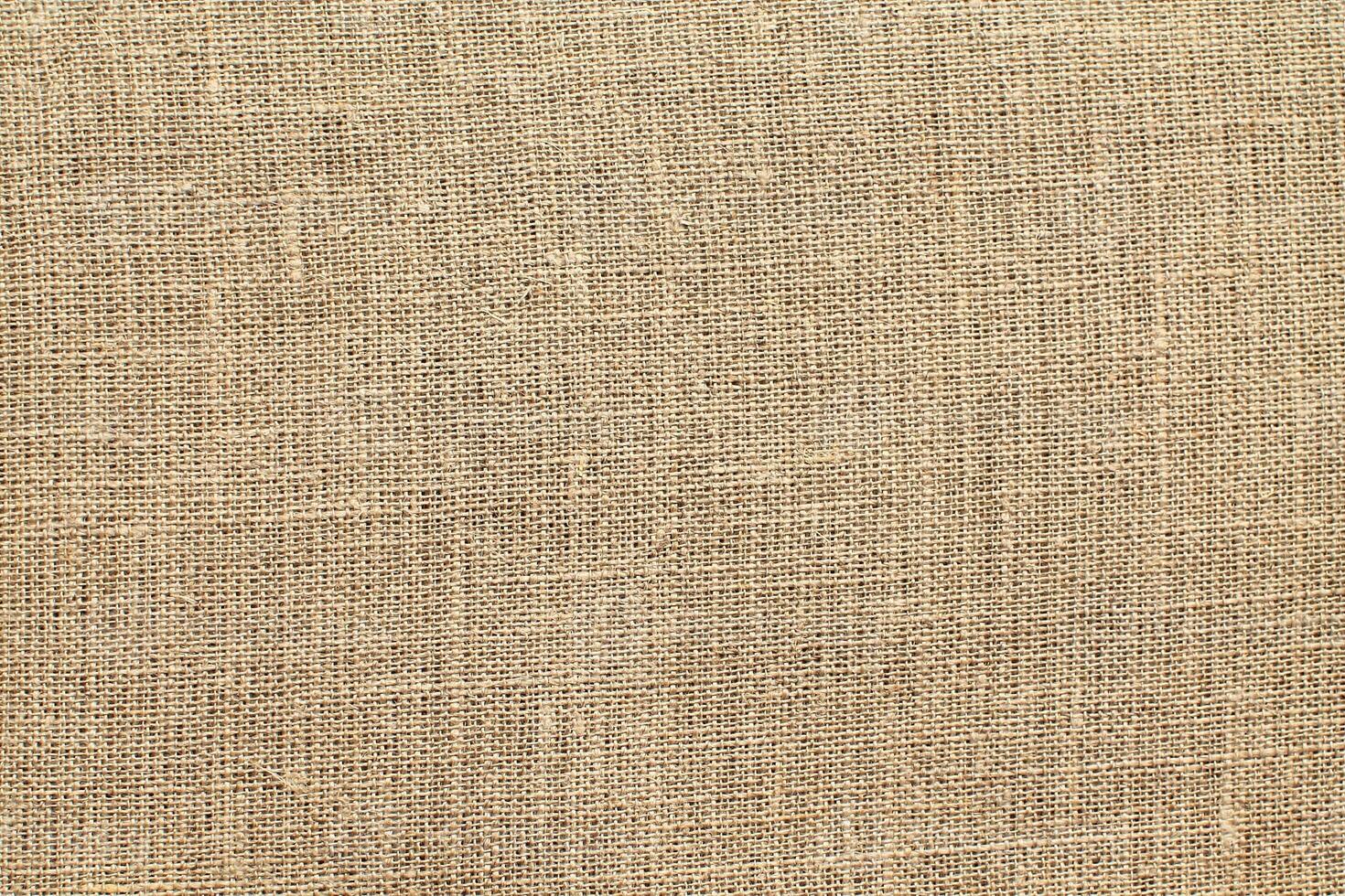 Natural linen material textile canvas Fabric texture background Close-up detail of fabric natural color Hemp material pattern design wallpaper. can be used as background or for graphic design photo