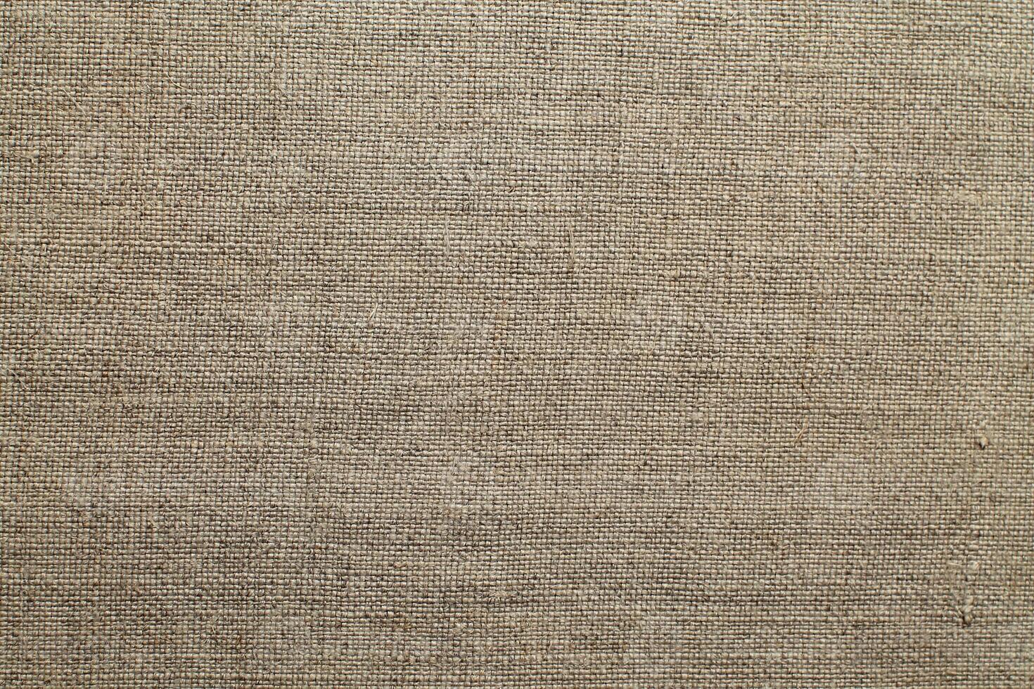 Natural linen material textile canvas Fabric texture background Close-up detail of fabric natural color Hemp material pattern design wallpaper. can be used as background or for graphic design photo