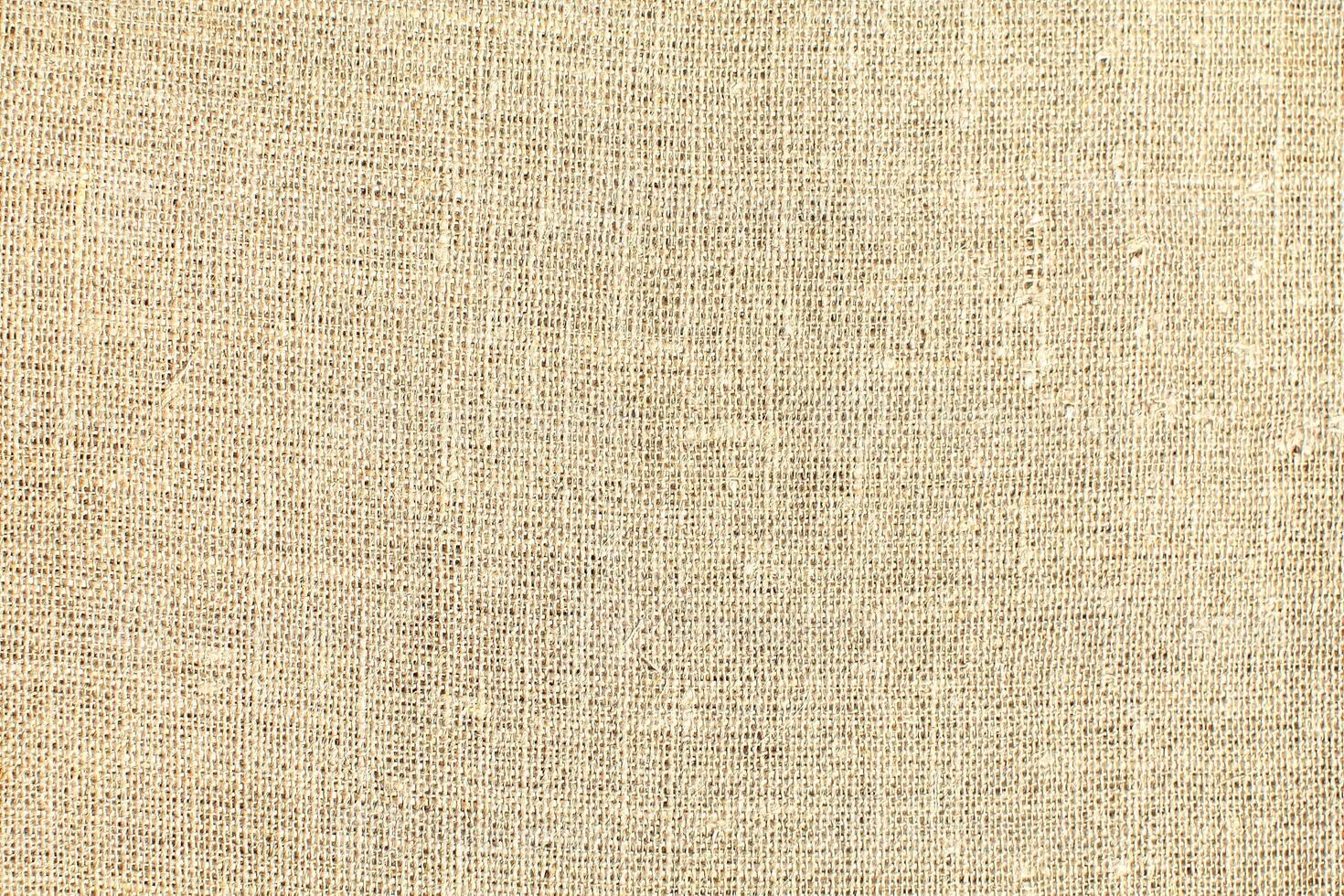 Natural linen material textile canvas Fabric texture background Close-up detail of fabric natural color Hemp material pattern design wallpaper. can be used as background or for graphic design photo