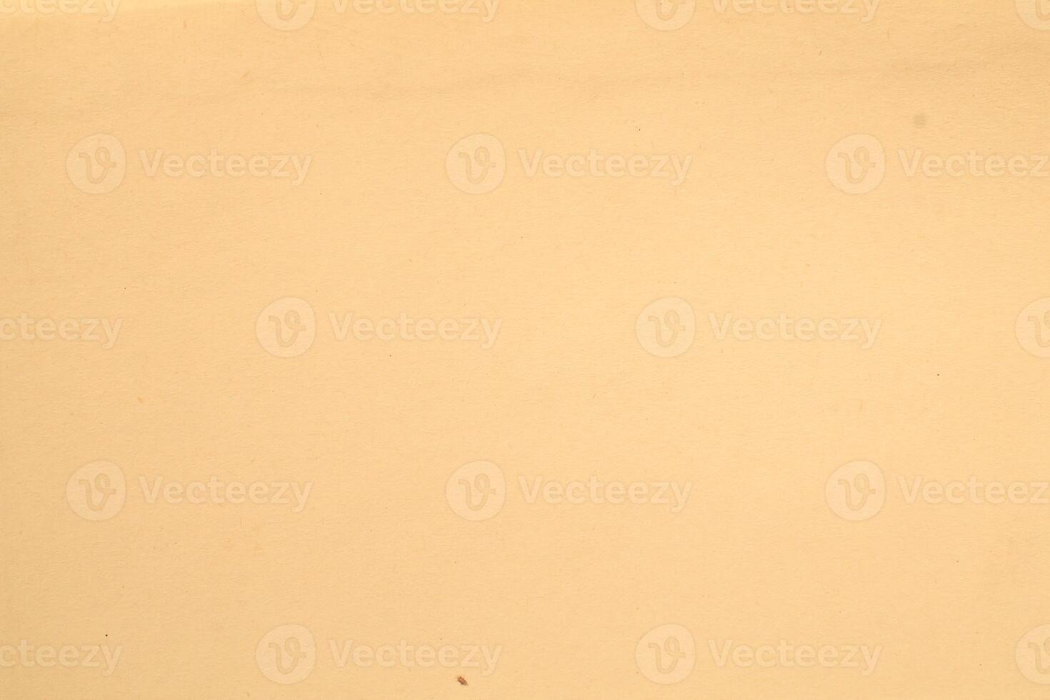 A man is standing on a beach with a surfboard photo