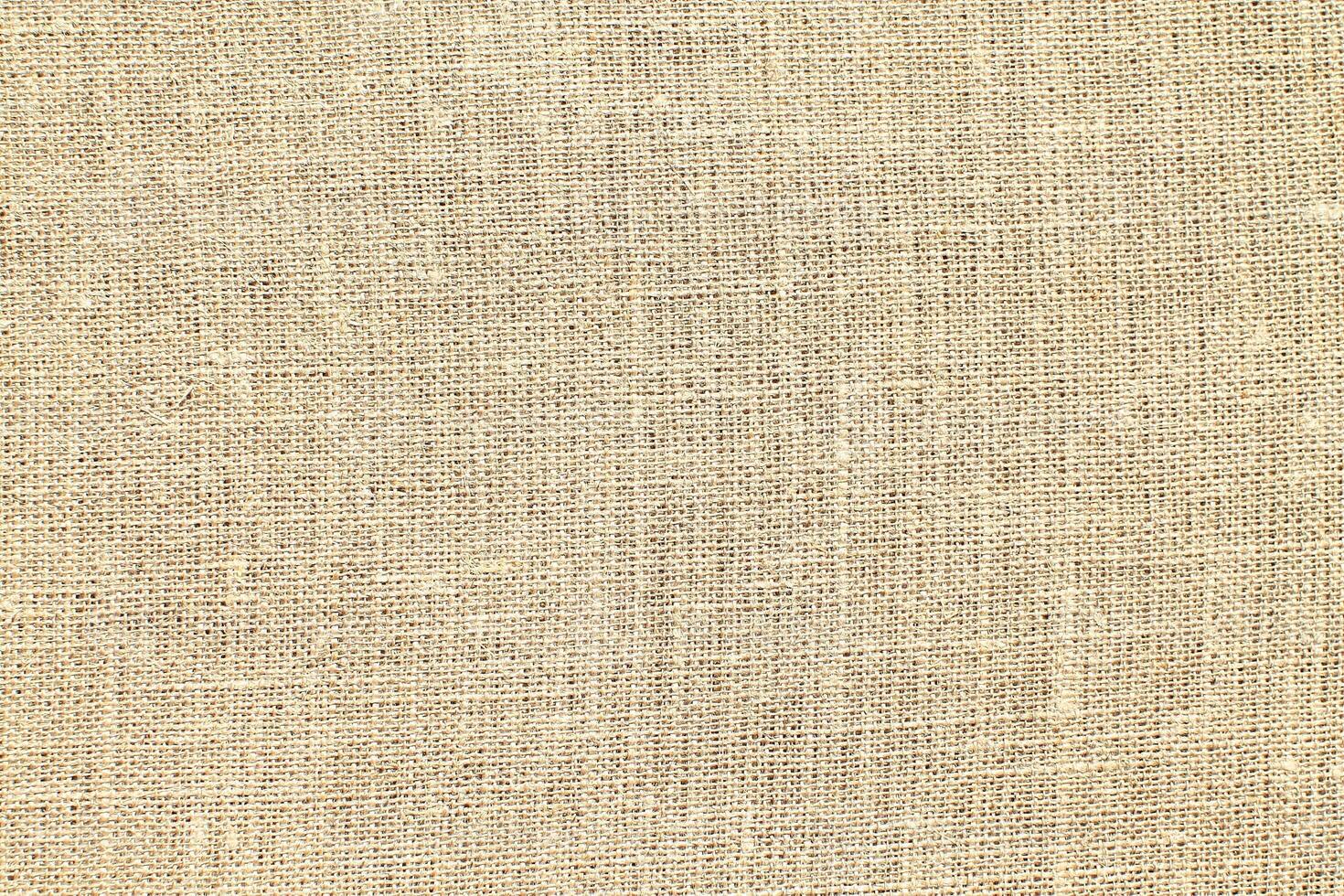 Natural linen material textile canvas Fabric texture background Close-up detail of fabric natural color Hemp material pattern design wallpaper. can be used as background or for graphic design photo