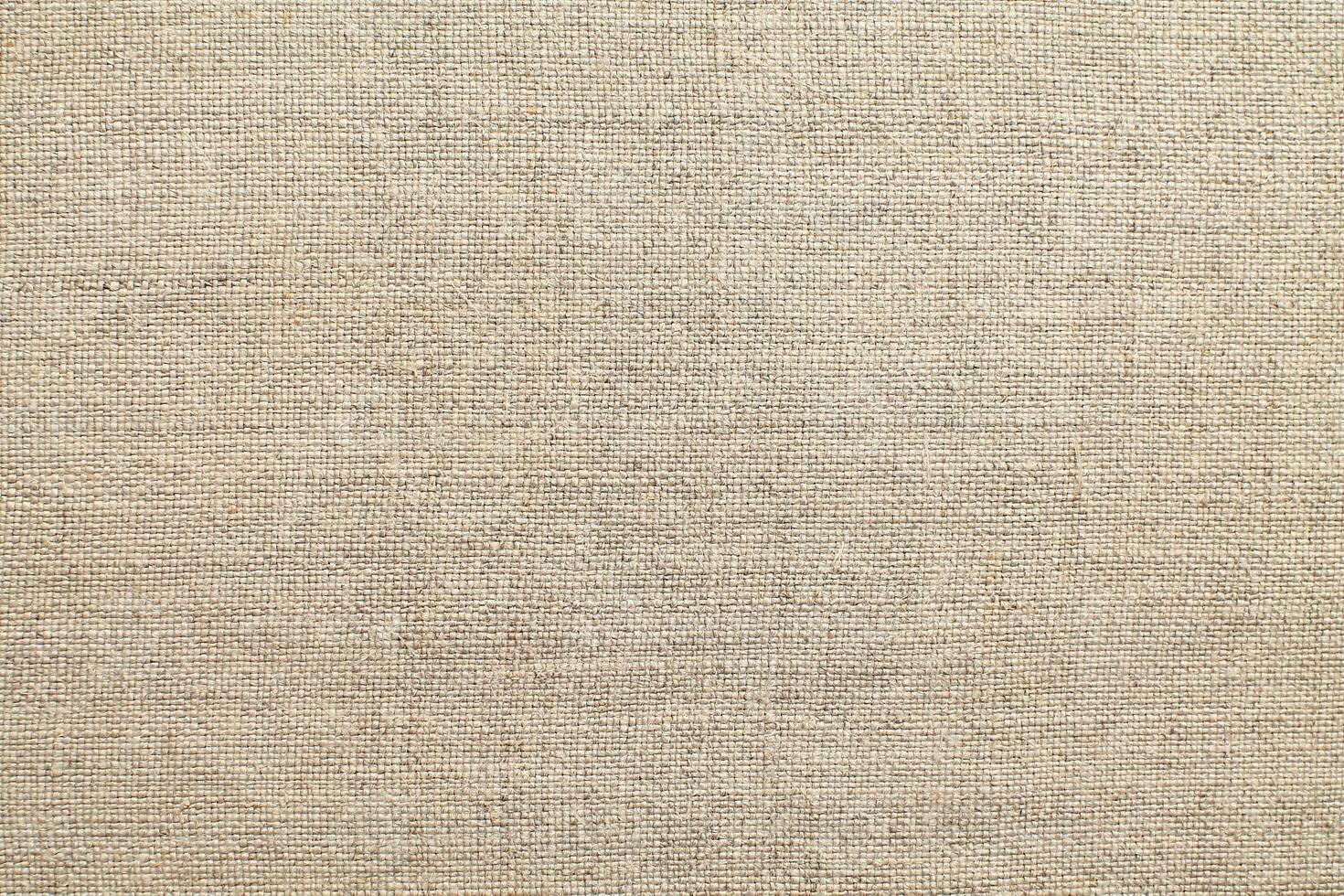 Natural linen material textile canvas Fabric texture background Close-up detail of fabric natural color Hemp material pattern design wallpaper. can be used as background or for graphic design photo