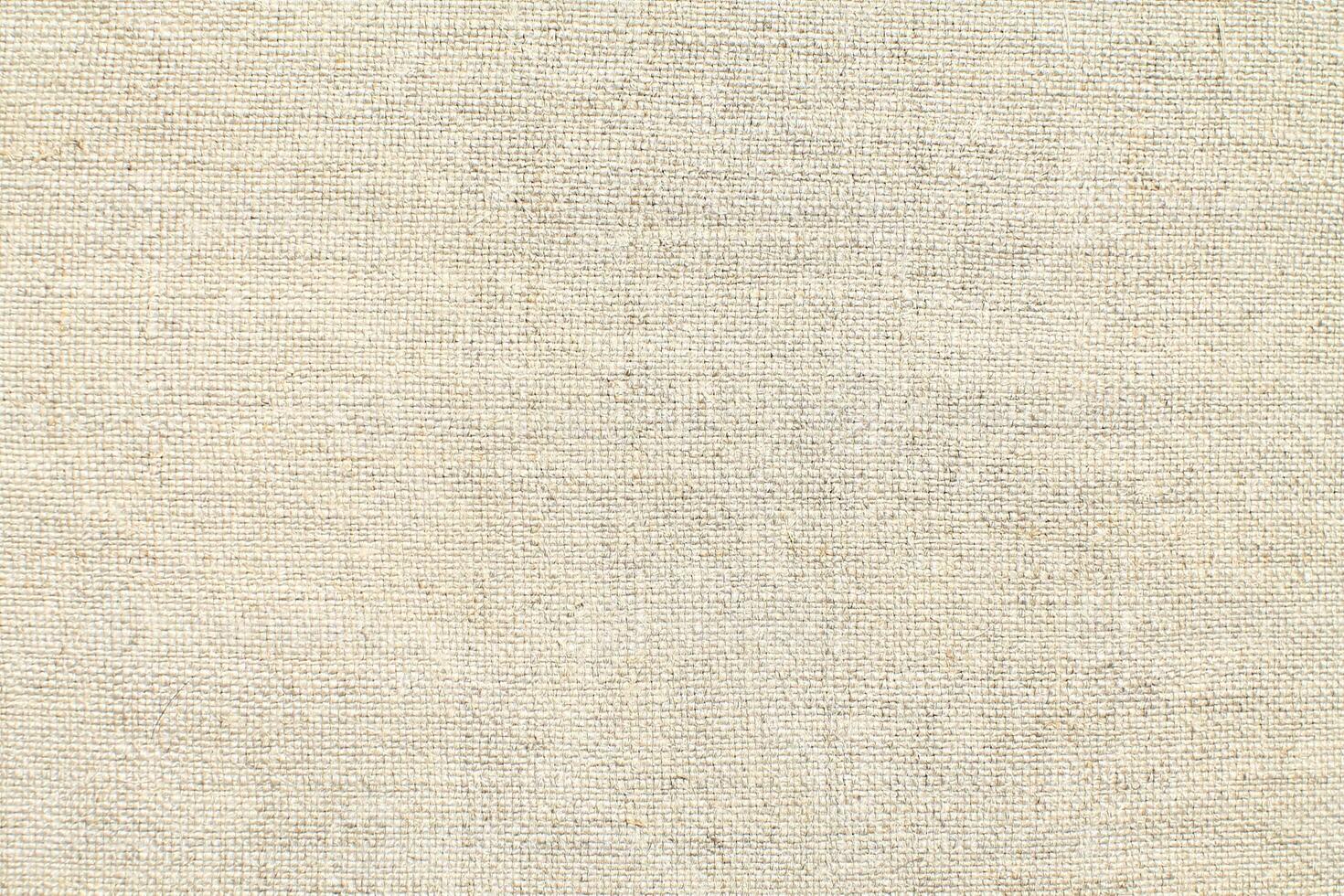 Natural linen material textile canvas Fabric texture background Close-up detail of fabric natural color Hemp material pattern design wallpaper. can be used as background or for graphic design photo