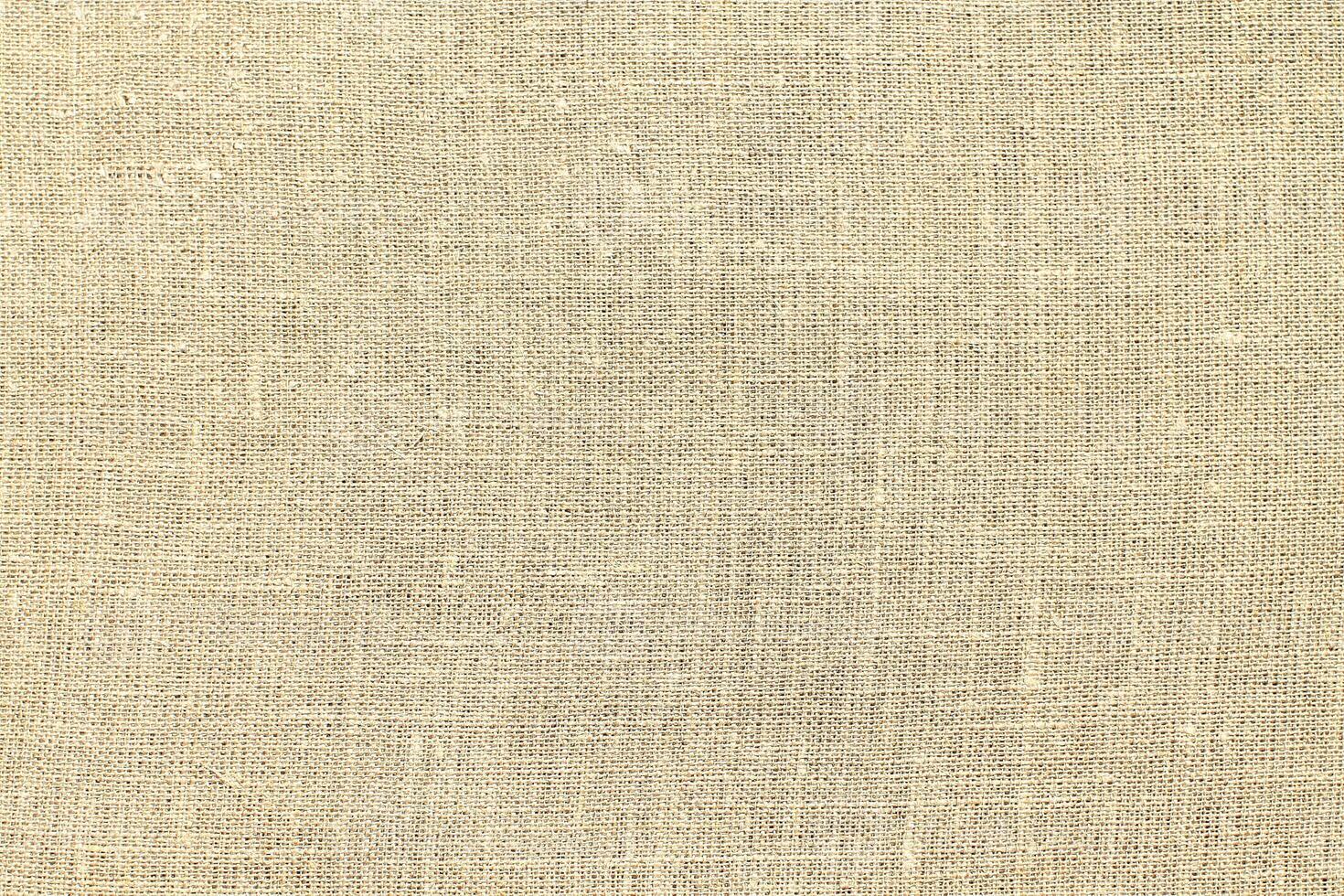 Natural linen material textile canvas Fabric texture background Close-up detail of fabric natural color Hemp material pattern design wallpaper. can be used as background or for graphic design photo