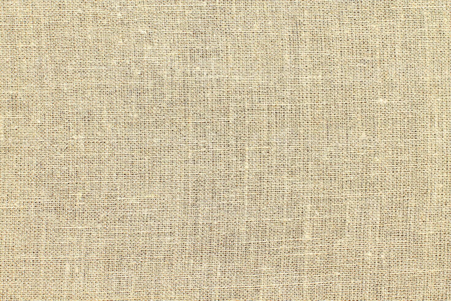 Natural linen material textile canvas Fabric texture background Close-up detail of fabric natural color Hemp material pattern design wallpaper. can be used as background or for graphic design photo