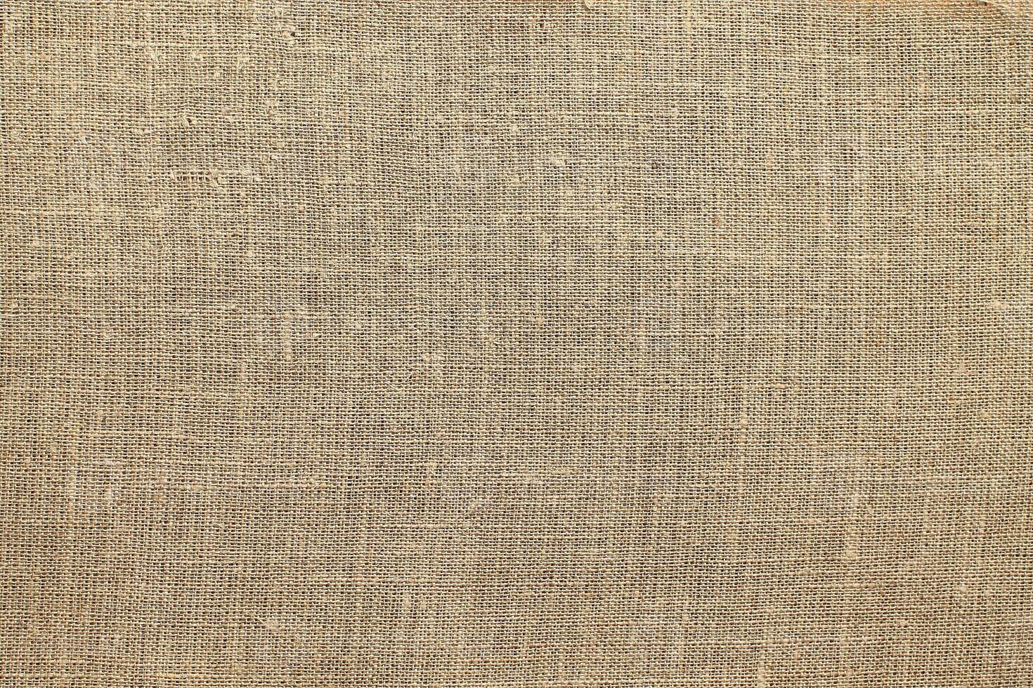 Natural linen material textile canvas Fabric texture background Close-up detail of fabric natural color Hemp material pattern design wallpaper. can be used as background or for graphic design photo