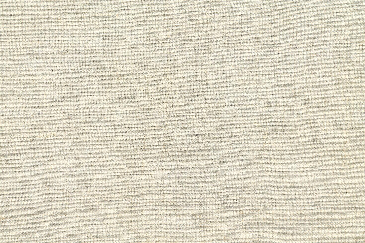 Natural linen material textile canvas Fabric texture background Close-up detail of fabric natural color Hemp material pattern design wallpaper. can be used as background or for graphic design photo