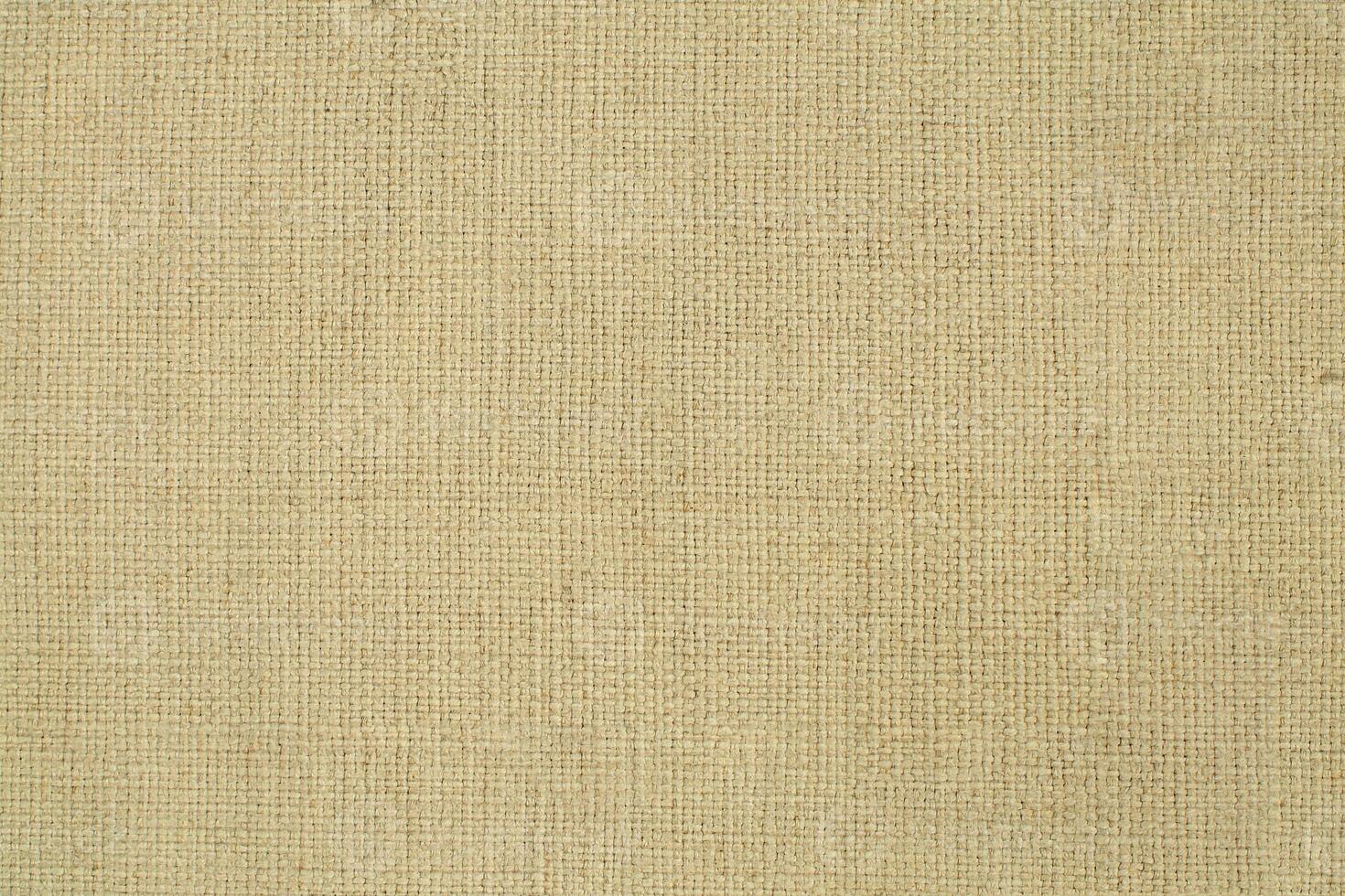 Natural linen material textile canvas Fabric texture background Close-up detail of fabric natural color Hemp material pattern design wallpaper. can be used as background or for graphic design photo