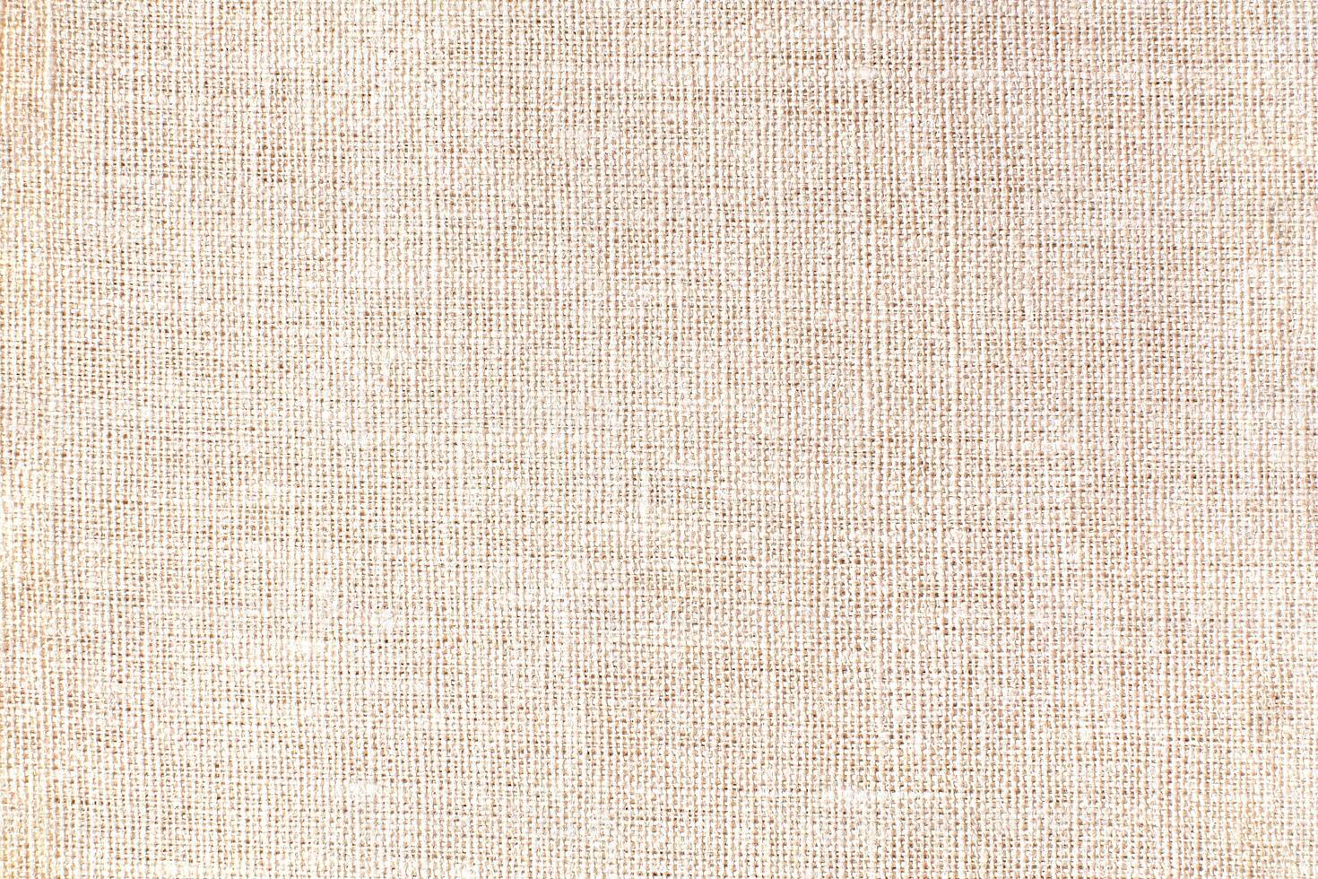 Natural linen material textile canvas Fabric texture background Close-up detail of fabric natural color Hemp material pattern design wallpaper. can be used as background or for graphic design photo