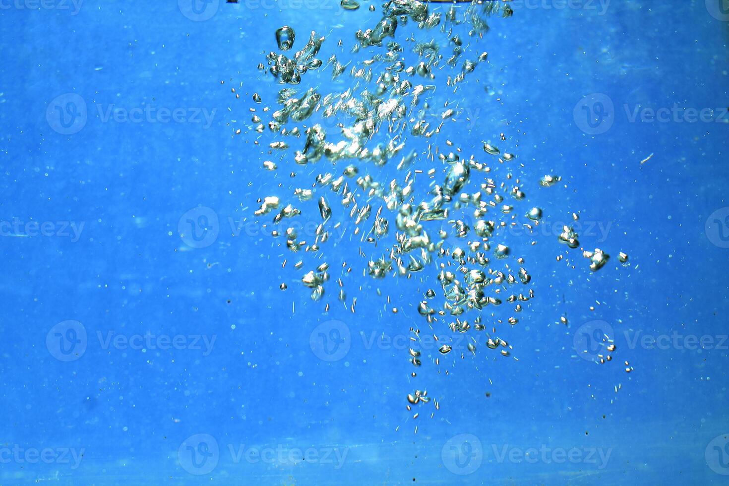 fresh water with underwater bubbles texture on a blue background close-up abstract liquid bubbles aqua design wallpaper photo