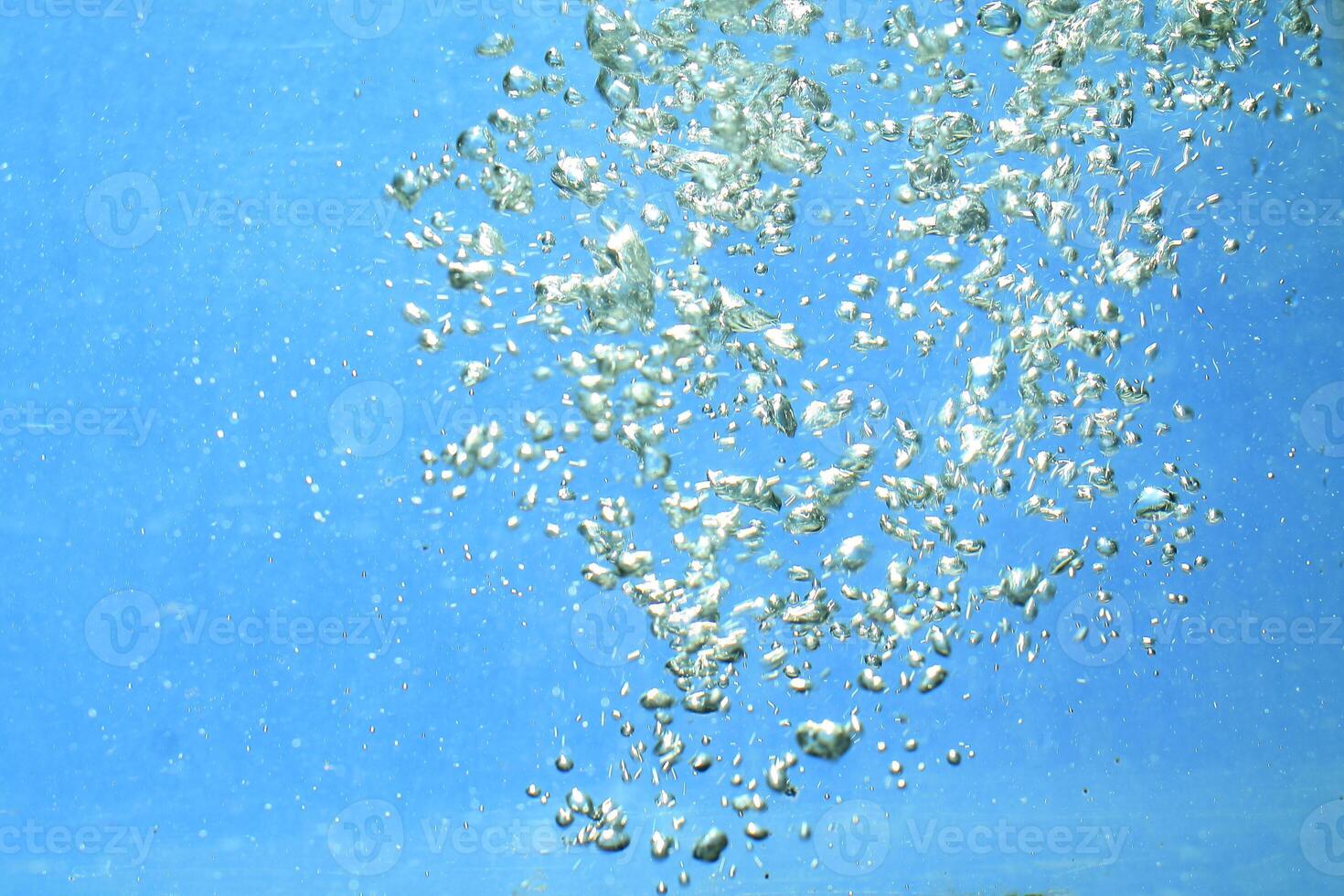 fresh water with underwater bubbles texture on a blue background close-up abstract liquid bubbles aqua design wallpaper photo