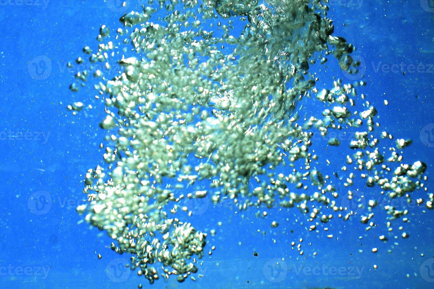 fresh water with underwater bubbles texture on a blue background close-up abstract liquid bubbles aqua design wallpaper photo