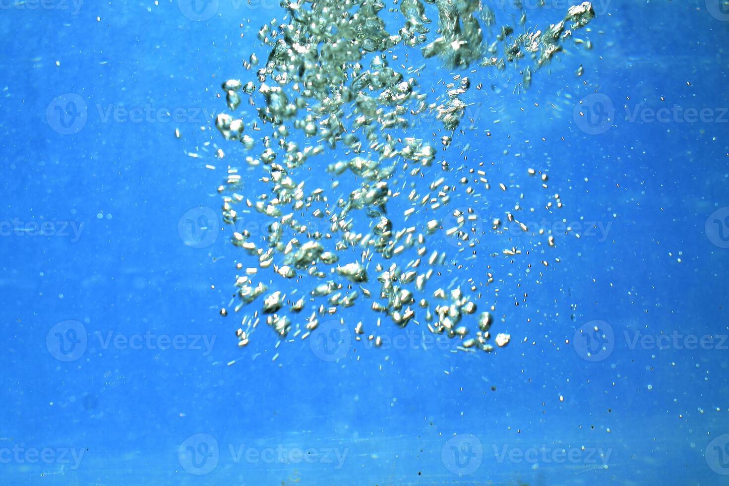 fresh water with underwater bubbles texture on a blue background close-up abstract liquid bubbles aqua design wallpaper photo
