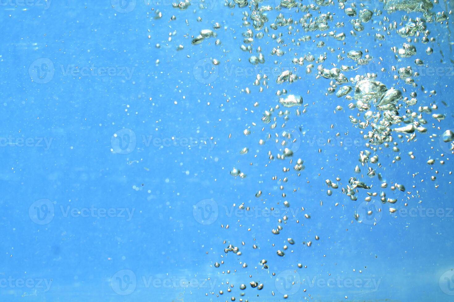 fresh water with underwater bubbles texture on a blue background close-up abstract liquid bubbles aqua design wallpaper photo