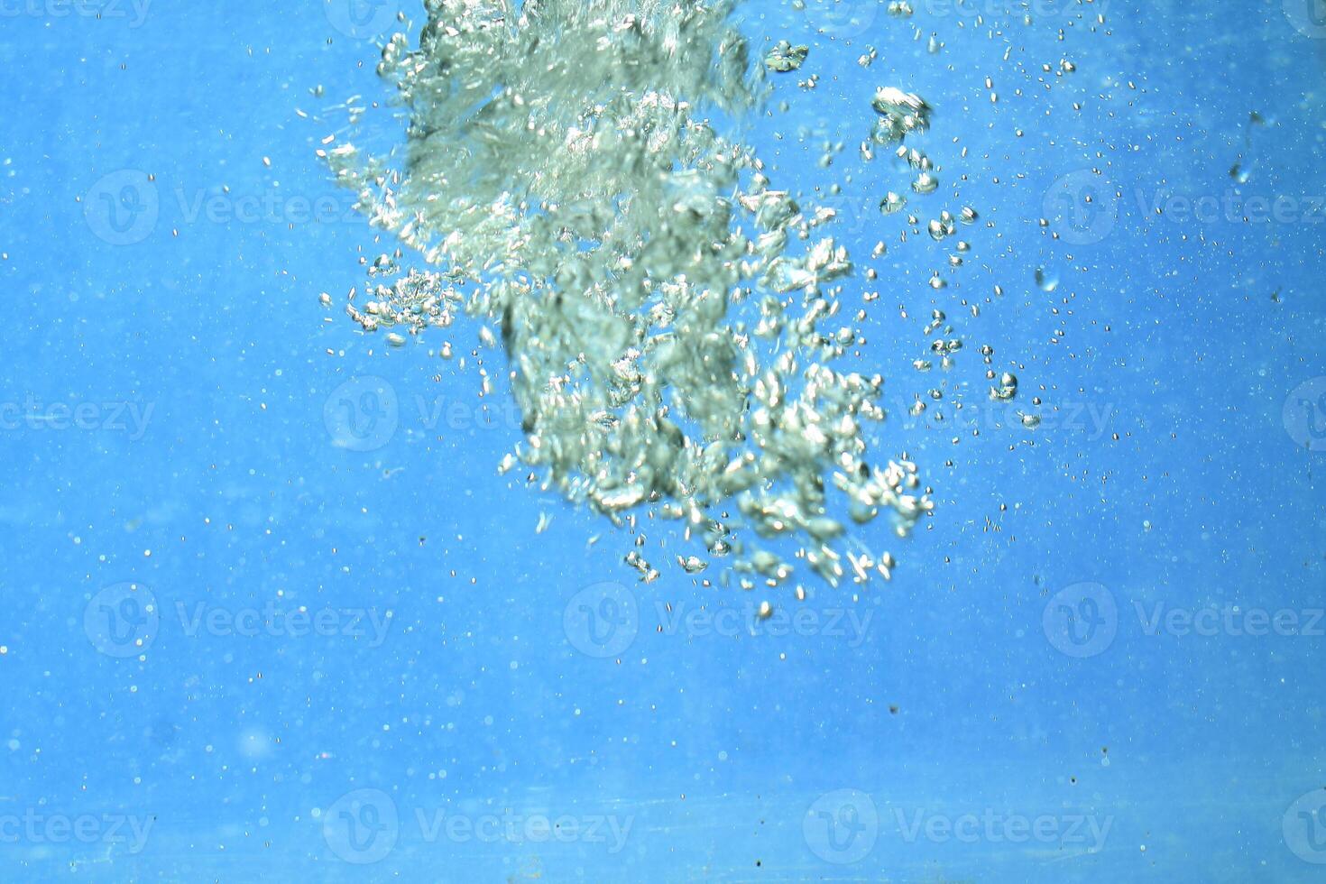 fresh water with underwater bubbles texture on a blue background close-up abstract liquid bubbles aqua design wallpaper photo