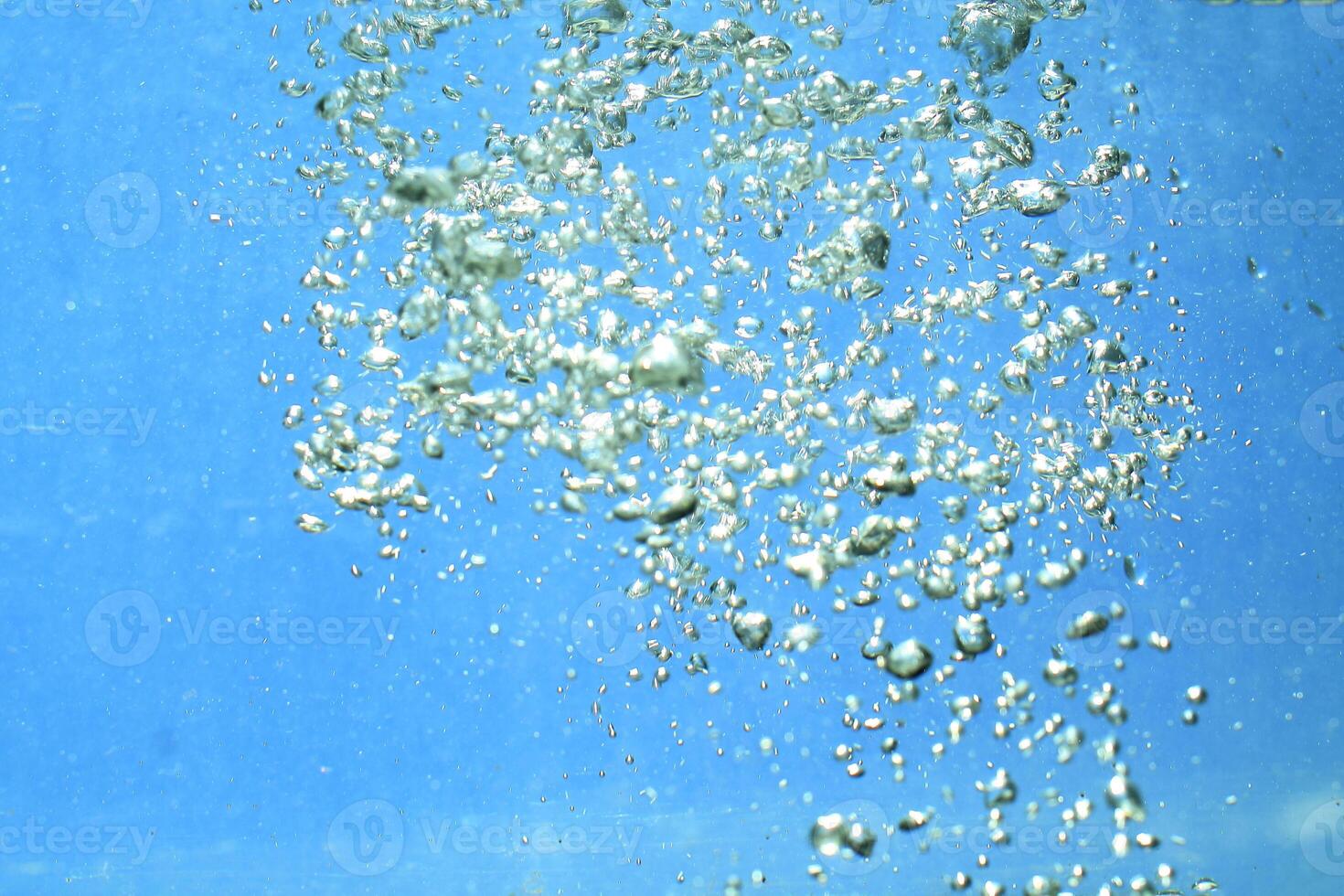 fresh water with underwater bubbles texture on a blue background close-up abstract liquid bubbles aqua design wallpaper photo