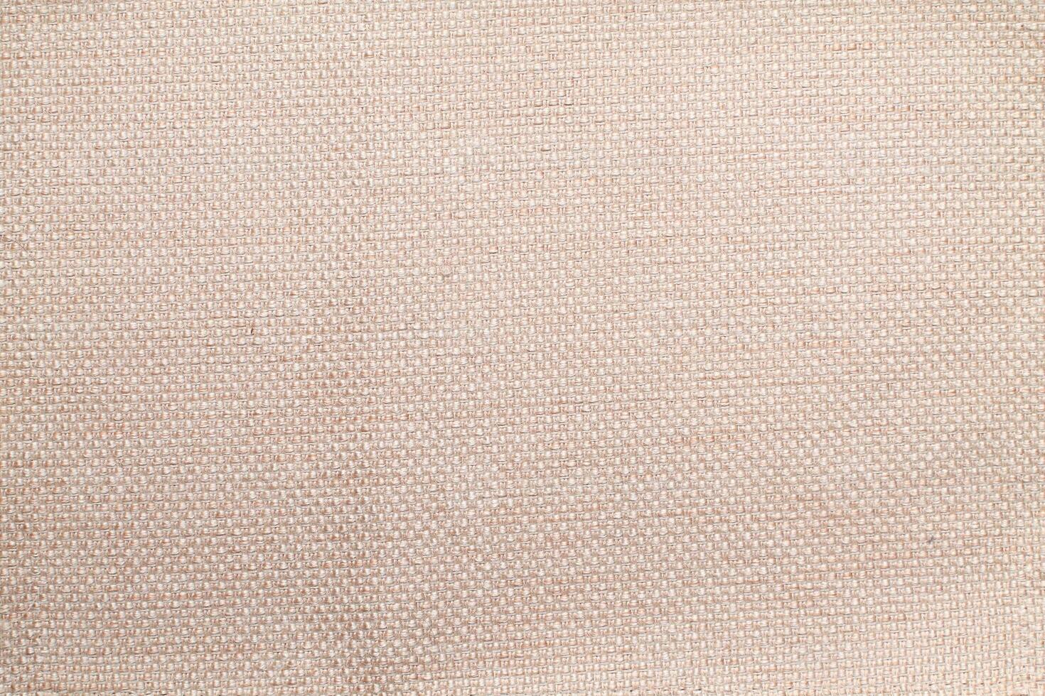 Natural linen material textile canvas Fabric texture background Close-up detail of fabric natural color Hemp material pattern design wallpaper. can be used as background or for graphic design photo