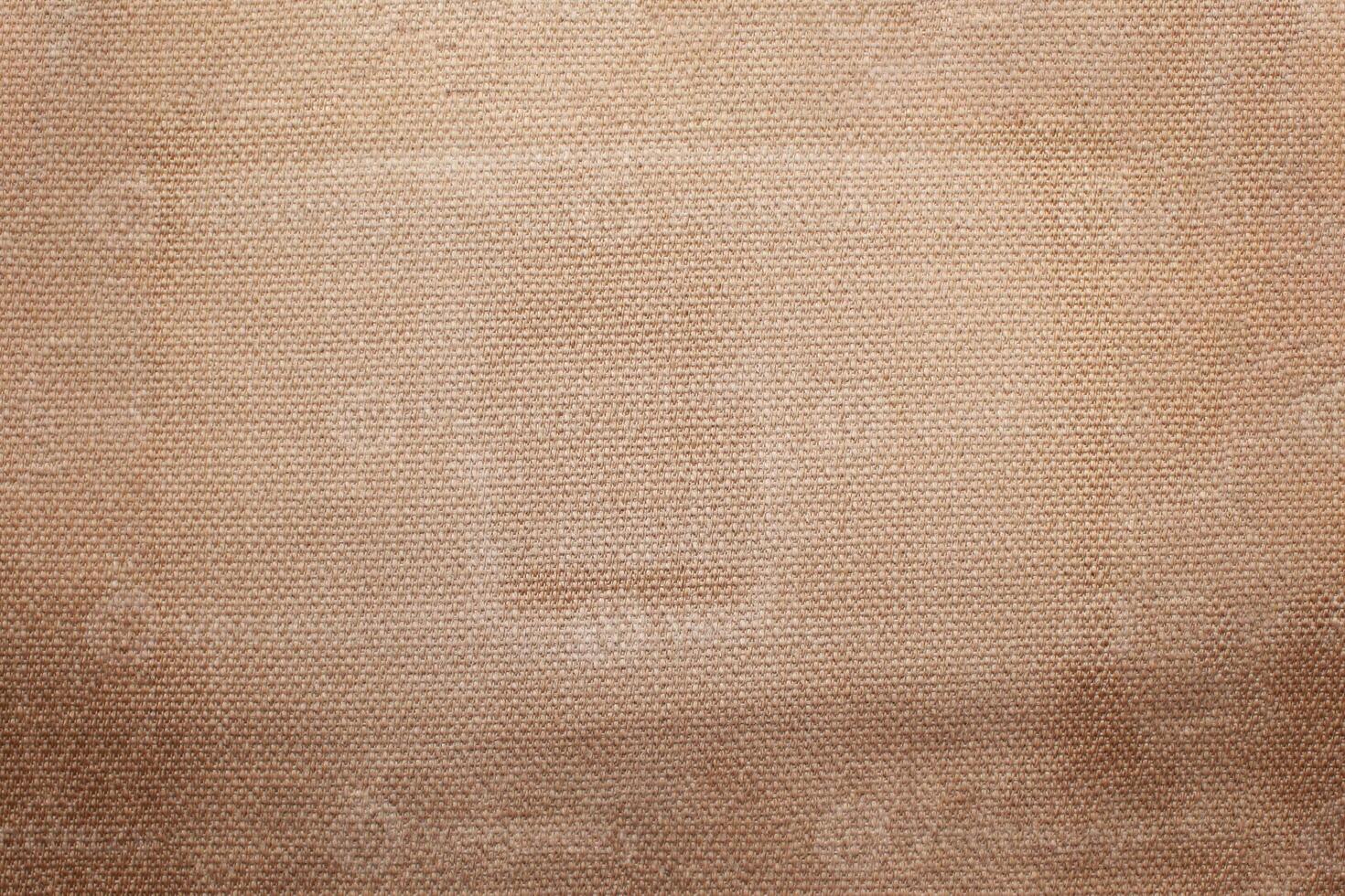 Natural linen material textile canvas Fabric texture background Close-up detail of fabric natural color Hemp material pattern design wallpaper. can be used as background or for graphic design photo
