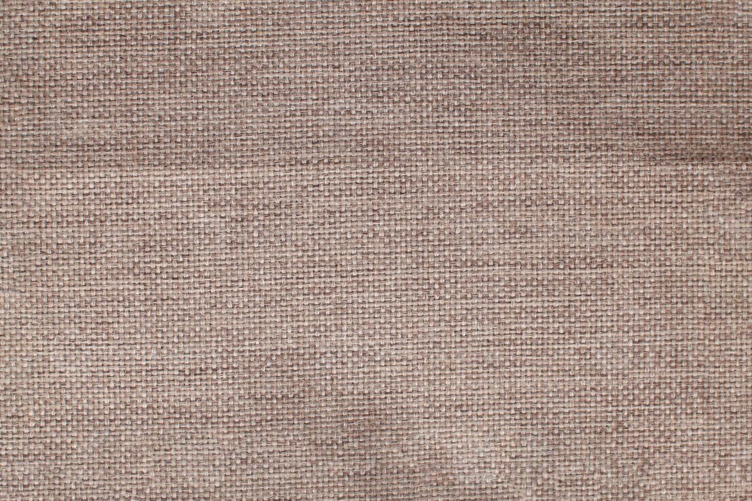 Natural linen material textile canvas Fabric texture background Close-up detail of fabric natural color Hemp material pattern design wallpaper. can be used as background or for graphic design photo