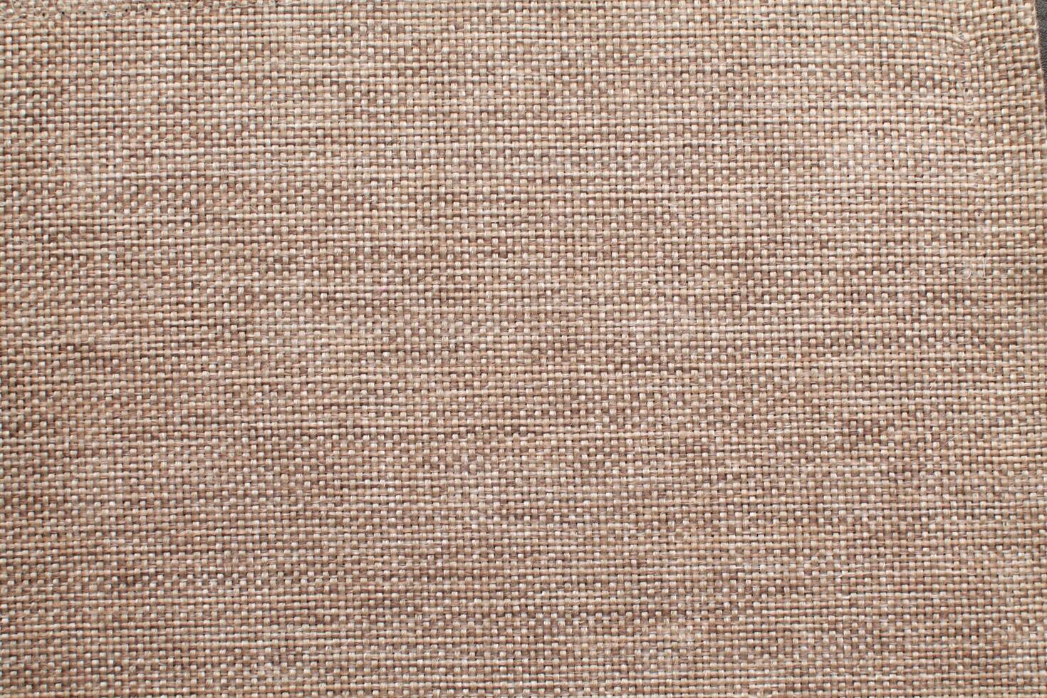 Natural linen material textile canvas Fabric texture background Close-up detail of fabric natural color Hemp material pattern design wallpaper. can be used as background or for graphic design photo
