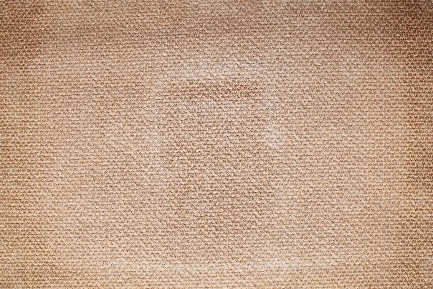 Natural linen material textile canvas Fabric texture background Close-up detail of fabric natural color Hemp material pattern design wallpaper. can be used as background or for graphic design photo