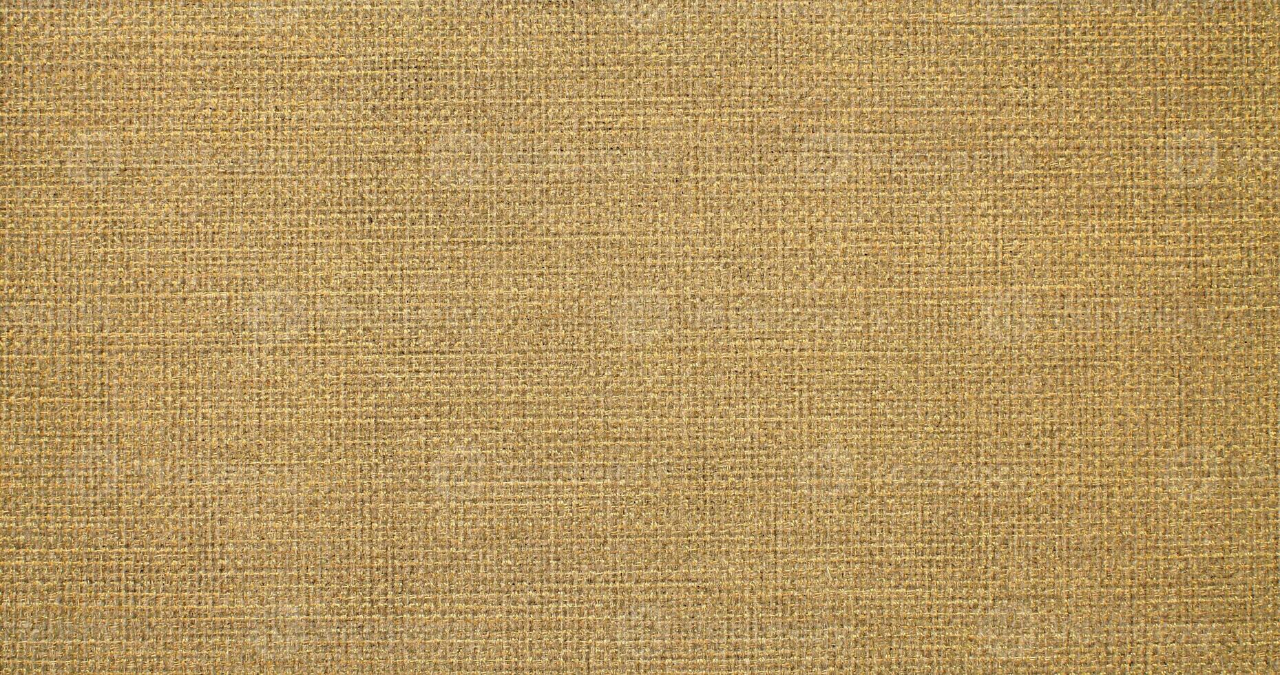 Natural linen material textile canvas Fabric texture background Close-up detail of fabric natural color Hemp material pattern design wallpaper. can be used as background or for graphic design photo