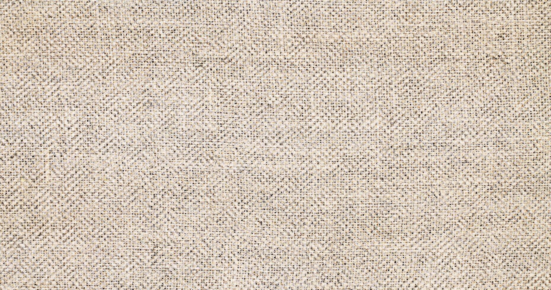 Natural linen material textile canvas Fabric texture background Close-up detail of fabric natural color Hemp material pattern design wallpaper. can be used as background or for graphic design photo