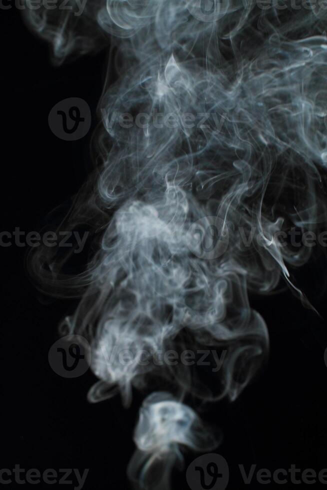 Abstract white smoke texture moves on black background Plume of smoke wave design wallpaper. Design element. Abstract texture photo