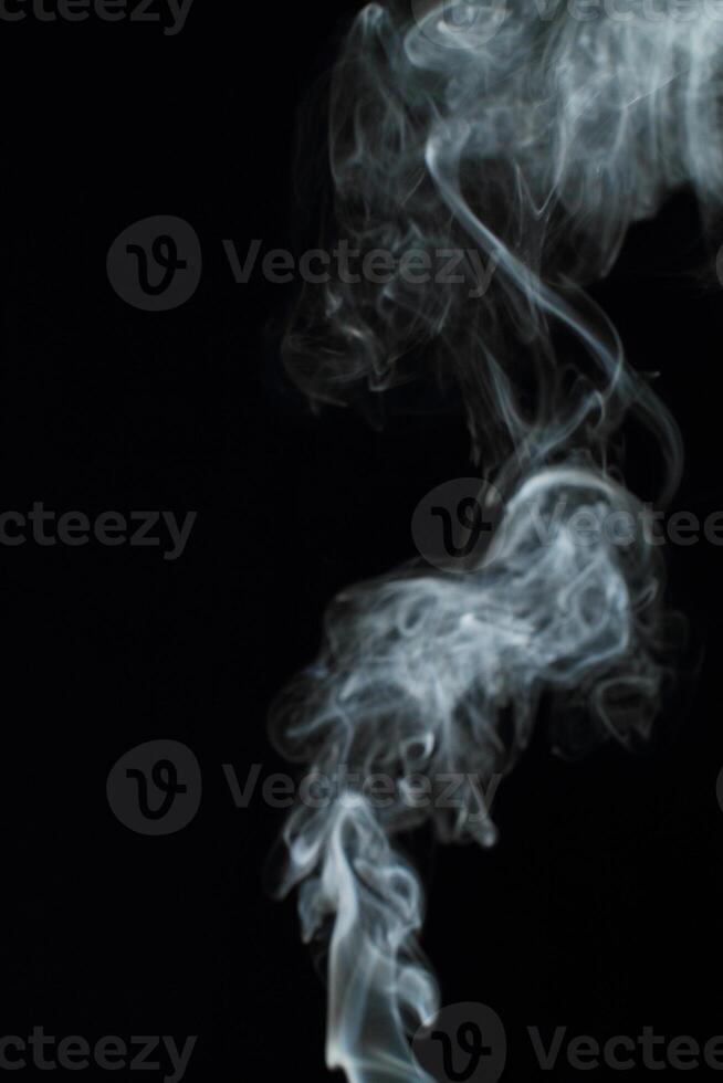 Abstract white smoke texture moves on black background Plume of smoke wave design wallpaper. Design element. Abstract texture photo
