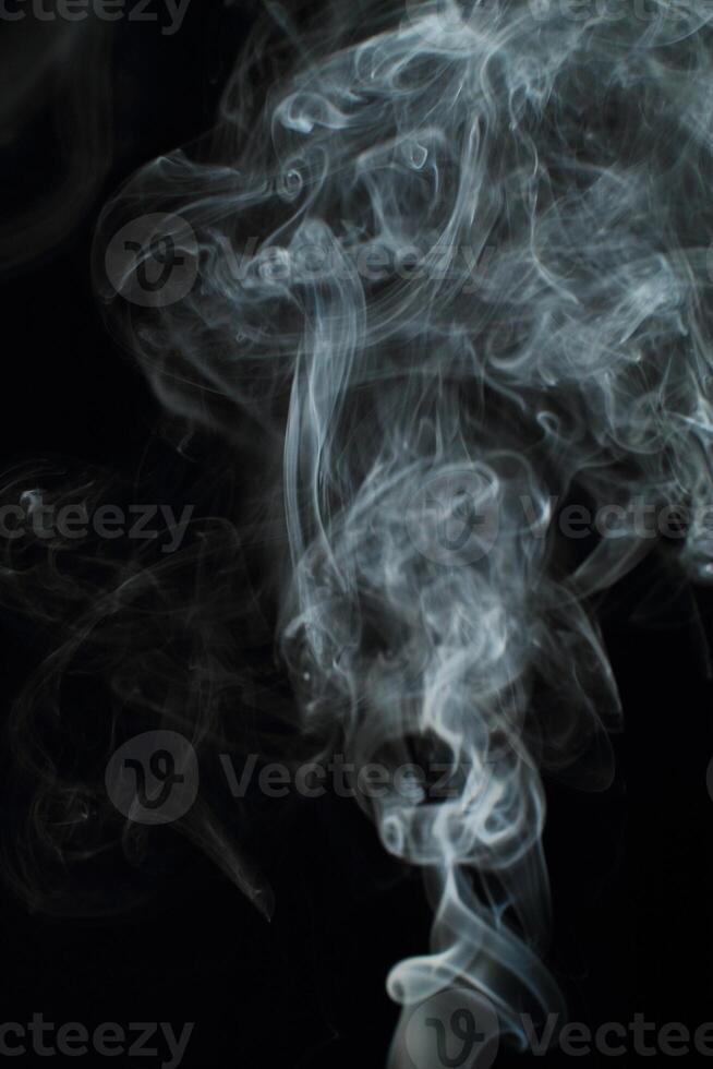 Abstract white smoke texture moves on black background Plume of smoke wave design wallpaper. Design element. Abstract texture photo