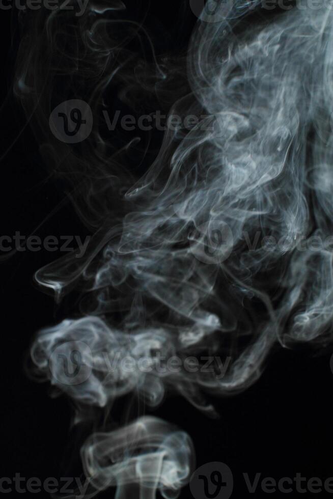 Abstract white smoke texture moves on black background Plume of smoke wave design wallpaper. Design element. Abstract texture photo