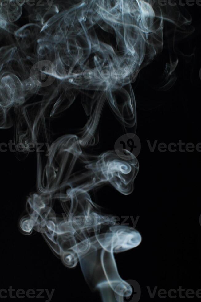 Abstract white smoke texture moves on black background Plume of smoke wave design wallpaper. Design element. Abstract texture photo