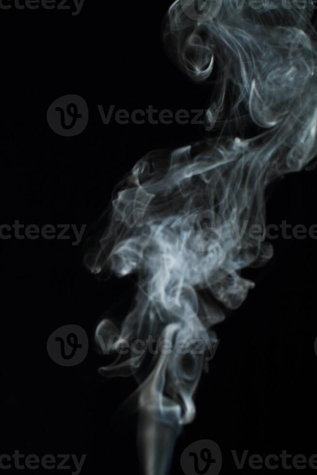 Abstract white smoke texture moves on black background Plume of smoke wave design wallpaper. Design element. Abstract texture photo