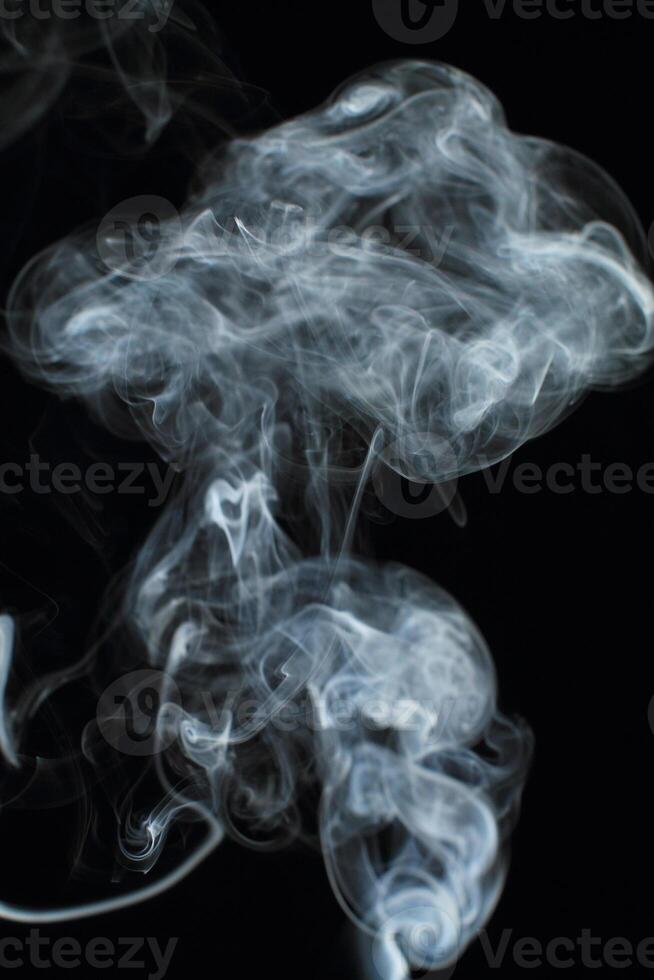 Abstract white smoke texture moves on black background Plume of smoke wave design wallpaper. Design element. Abstract texture photo
