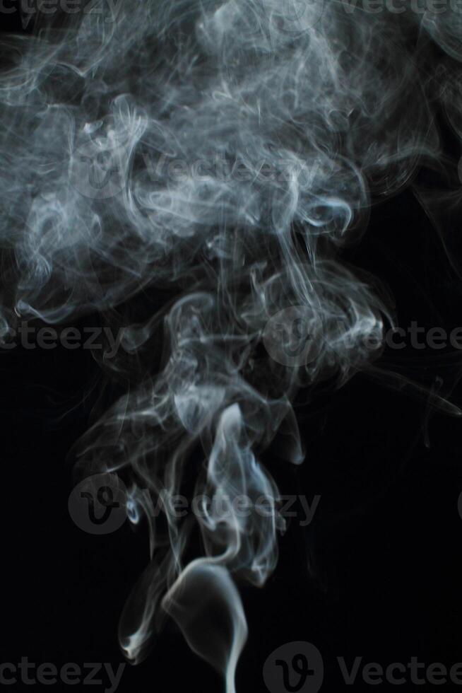 Abstract white smoke texture moves on black background Plume of smoke wave design wallpaper. Design element. Abstract texture photo