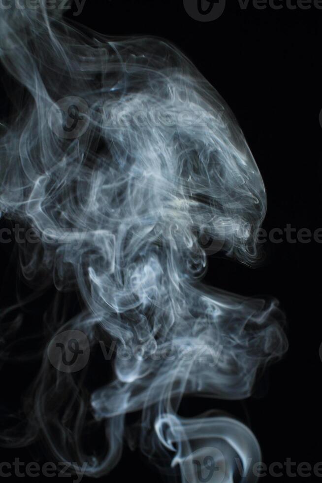 Abstract white smoke texture moves on black background Plume of smoke wave design wallpaper. Design element. Abstract texture photo