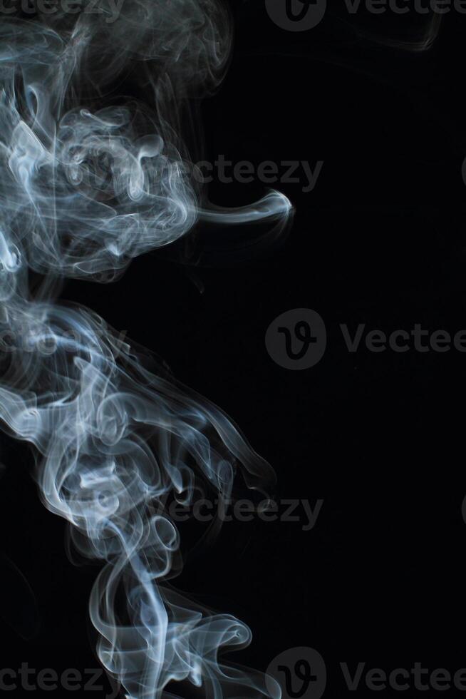 Abstract white smoke texture moves on black background Plume of smoke wave design wallpaper. Design element. Abstract texture photo